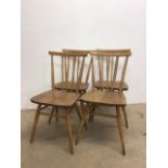 A set of four Ercol stick back chairs in beech and elm. W:39cm x D:35cm x H:approx 79cm