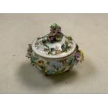 A Meissen lidded pot with floral and gilt decoration. H:7cm