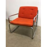 A metal framed seventies style arm chair with removable cushion W:70cm x D:70cm x H:75cm