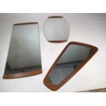Three mid century mirrors including an over mantle mirror - all teak trimmed Largest mirror