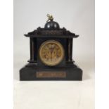 Slate eight day mantle clock with key. W:36cm x D:18cm x H:35cm