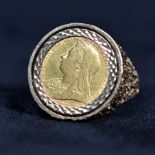 A half sovereign signet ring in a 9ct gold mount. 10.5g Size S