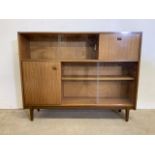 A Nathan mid century teak bookcase. With four glazed doors and and two cupboards.W:122cm x D: