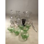 A collection of glass including decanters, six uranium glass dishes and a ladle