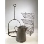 A collection of vintage metal ware items to include a boot scraper, a water pitcher and storage
