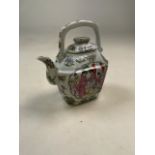 An Oriental Chinese hand painted teapot. Hand painted characters to baseW:17cm x D:9cm x H:20cm