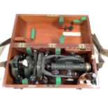 A VINTAGE THEODOLITE WITH MAHOGANY CASE SUPPLIED BY E R WATTS & SON OF LONDON.