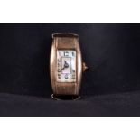 A 9ct gold early 20th century ladies oblong cocktail watch. Curved 16mm x 24mm case with mother of