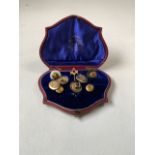 A 9ct gold Masonic tie pin together with a set of yellow metal cuffs and studs with horseshoe