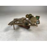 An early 20th century brass sextant, marked Stanley. W:21cm x D:11cm x H:22cm