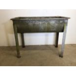 A galvanised metal feeding water trough. W:98cm x D:53cm x H:77cm