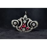 A French diamond and ruby Art Nouveau pendant,7.7g. set throughout with old cut diamonds and three