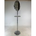 A stainless steel standard tilt and turn vanity mirror on circular base with towel rail. W:35cm