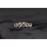 A n 18ct gold and diamond five stone ring. Five brilliant cut diamonds each approximately 4.5mm