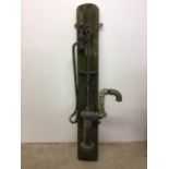 A vintage water pump mounted on wooden plinth W:45cm x D:20cm x H:164cm
