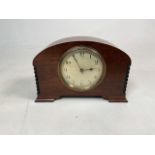 An Edwardian mahogany mantle clock engine turned face with arabic markers marked Peace, Leeds,