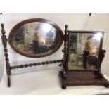 Two swing mirrors. One mahogany on stand and an oak bevel edged mirror on twisted legs Oak