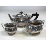 A Victorian sterling Silver three piece bachelors tea set with half fluted decoration by William