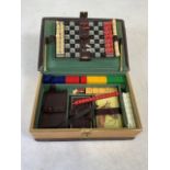 A 20th century portable games compendium with cards, chess board and fold out dice tray