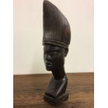 A hardwood African head W:10cm x D:13cm x H:36cm
