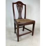 An oak dining chair with rattan seat.W:52cm x D:39cm x H:94cm
