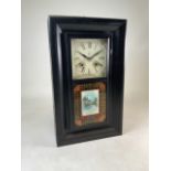 A black painted American wall clock with battery movement W:39cm x D:11cm x H:66cm