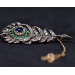 A late 19th early 20th century diamond sapphire and emerald feather brooch. In unmarked precious