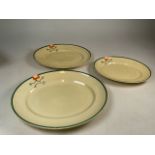 A set of three graduated serving platters by Clarice Cliff in the Ravel pattern signed Bizarre by