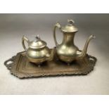 Brass Indian tray with a tea and a coffee pot. Pots with decorative finials. Height coffee pot 25cm
