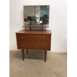 A two drawer veneered mid century dressing chest with mirror and shelfW:69cm x D:41cm x H:114cm
