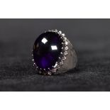 An 18ct white gold ladies dress ring centrally set with large cabochon cut amethyst 25mm x 20mm