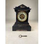 A French slate mantel clock with numbered movement. H:31cm