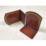 A pair of Moroccan leather collapsible book end.