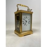 A late 19th early 20th century French four glass gilt brass carriage clock. Movement marked made