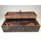 A wooden tool box containing a number of saws some by Joseph Tarzak and C Parks