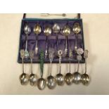 A collection of Chinese Export unmarked white metal and silver tea spoons to include a jade