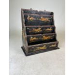 A chinoiserie lacquered four tier letter holder decorated with tigers W:30cm x D:15.5cm x