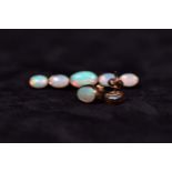 A suite of opal jewellery to include a pair of oval 9ct set ear studs