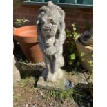 A stone statue of a lion. H:54cm