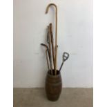 A coopered barrel oak stick stand together with a shepherds crook, a shooting stick and other