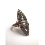A late 18th early 19th century unmarked precious yellow metal and diamond navette shaped ring. Set