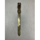 A Japanese copper letter opener with mixed metal colour handle, cranes and reeds incised on the
