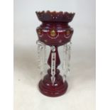 A hand decorated cranberry glass drop lustre with spare lustres W:18cm x H:36cm