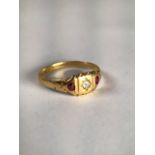 An 18ct gold ruby and diamond ring . 2.5g Size P.