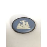 A Wedgwood cameo brooch in white metal mount.