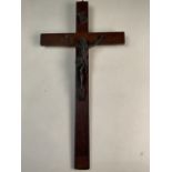 A metal figure of Christ on an oak crucifix. W:26cm x H:49cm