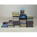 A collection of cassettes to include Seal, Annie Lennox, Elton John, Dire Straits, Eagles, Genesis