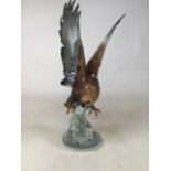 A Hutschenreuther German model of a eagle. Stamped 17 to base. H:45cm Condition: damage to wing tip-