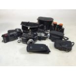 A collection of analog cameras and cases to include Olympus, Coronet, two Kodak instamatic camera