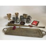 A collection of pewter, brass and wood items to include a brass tray, pewter tankards and a horn.